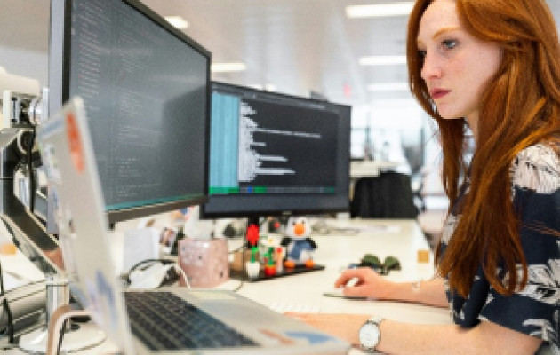 Image of woman sat at computer