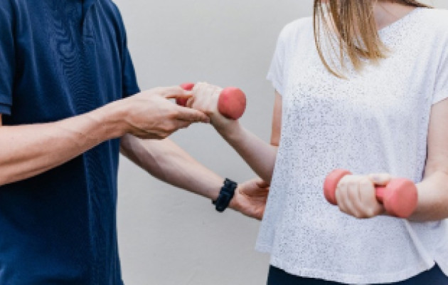 Image of people with bar bells
